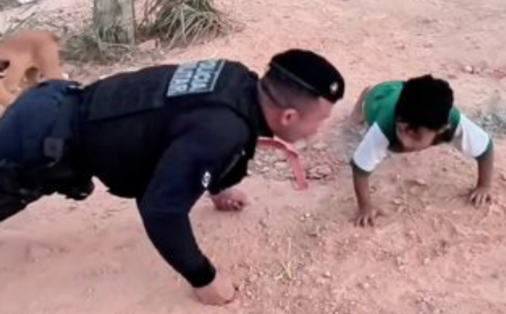Menino de 4 anos desafia PM e faz 33 flexões com ele na rua, em Cuiabá; vídeo